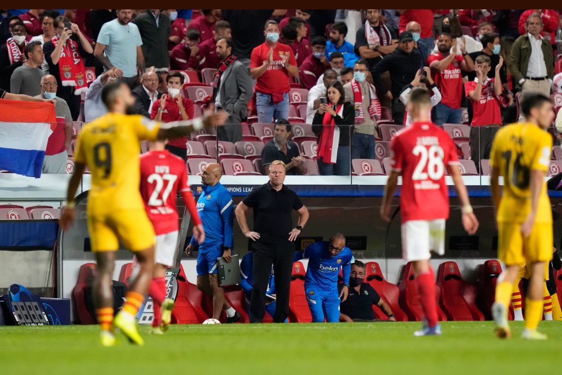 Koeman watches as players leave the field at half time.