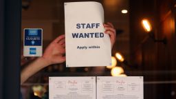 A staff wanted sign in the window of a restaurant in the Soho district of London, on Sept. 7, 2021. 