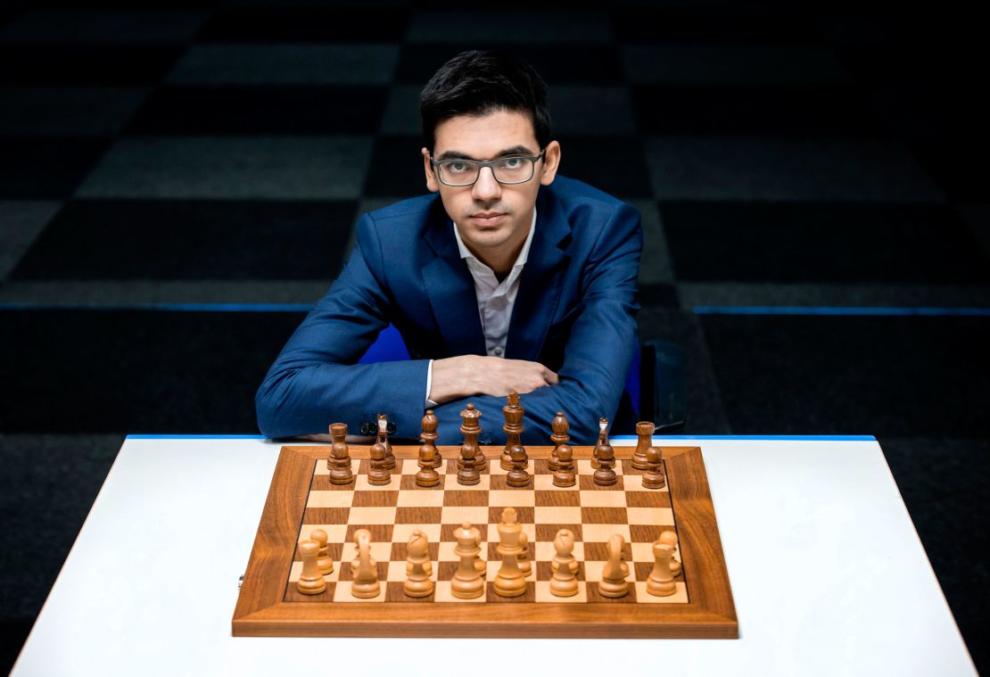 Grown men play chess using a watch to control time