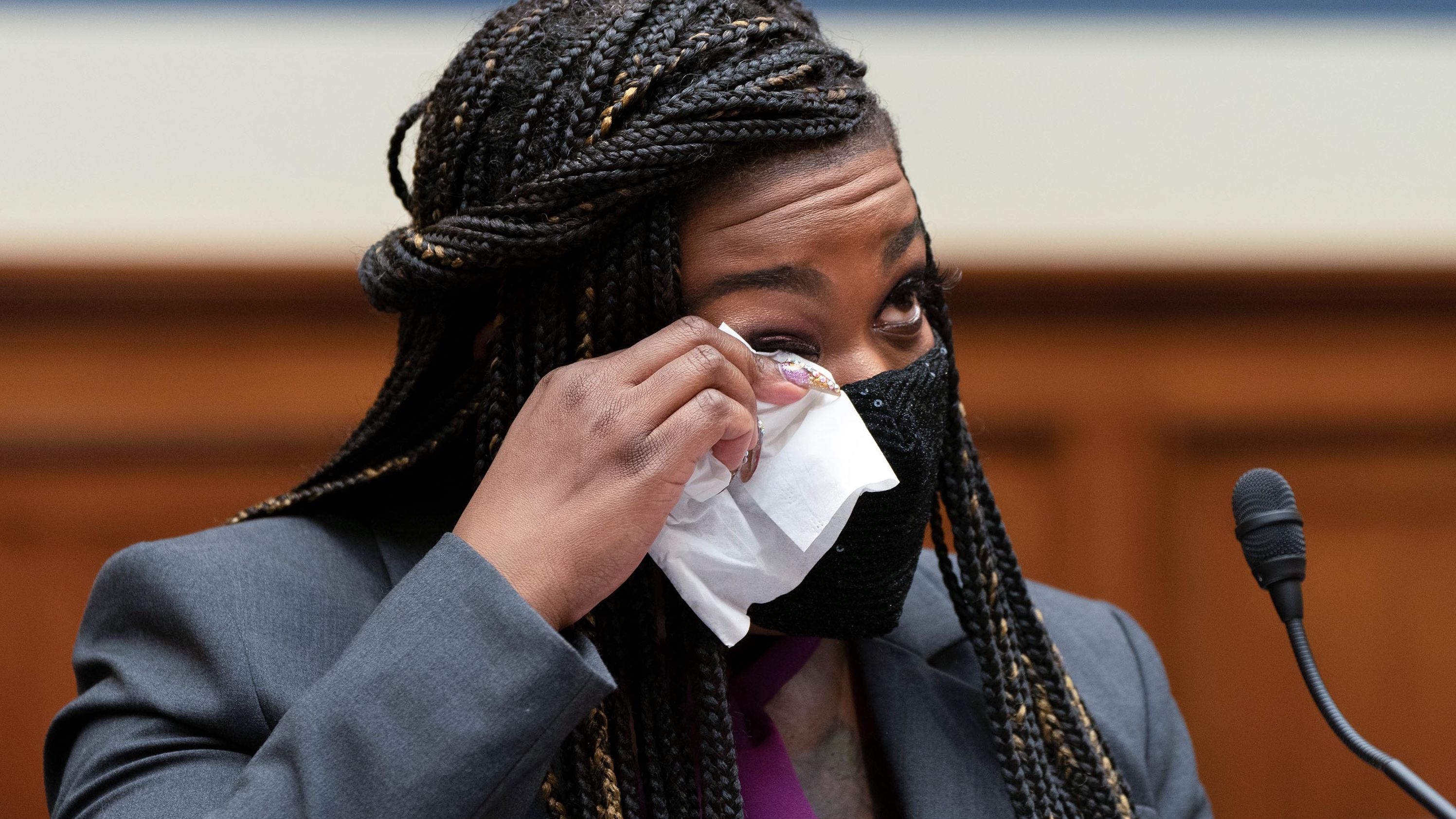 Rep. Cori Bush, D-Mo., wipes away a tear as she prepares to testify about her experience being raped and a subsequent abortion, Thursday, Sept. 30, 2021, during a House Committee on Oversight and Reform hearing on Capitol Hill in Washington.