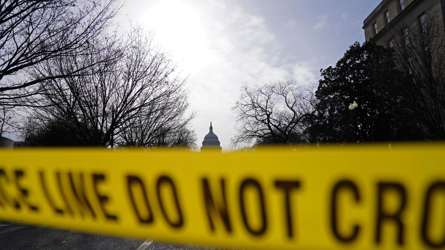 The US Capitol is seen behind yellow police tape on January 16, 2021, in Washington, DC. 