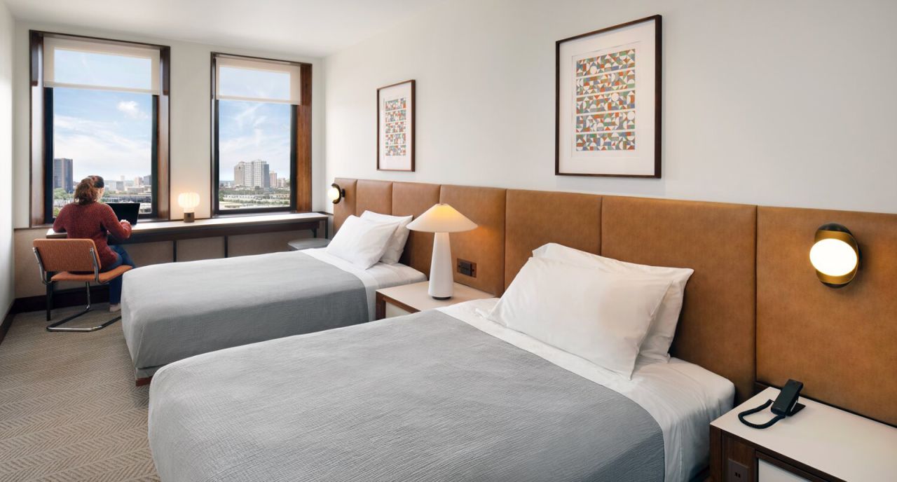The 165-room hotel will be called Hotel Marcel (with a finished model room pictured here), a nod to the building's original architect. It will be branded under Hilton Hotel Group's Tapestry Collection and is projected to be the first net-zero hotel in the US.