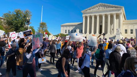 Demonstrators march past the Supreme Court in the nationwide Women's March on October 17, 2020, in Washington, DC.