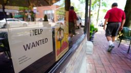 Restaurant storefront on Middle Neck Road in Great Neck, New York has "Help Wanted" sign in window on July 15, 2021. 