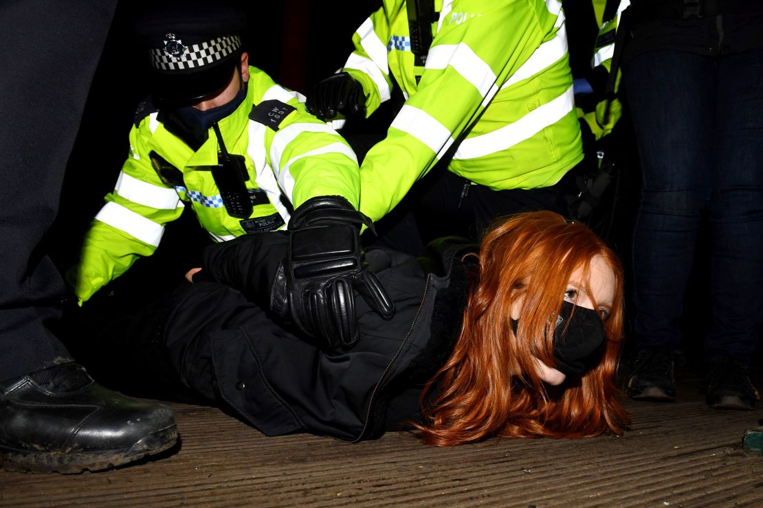 A woman attending the Sarah Everard vigil in south London on March 13, 2021 is arrested by police.