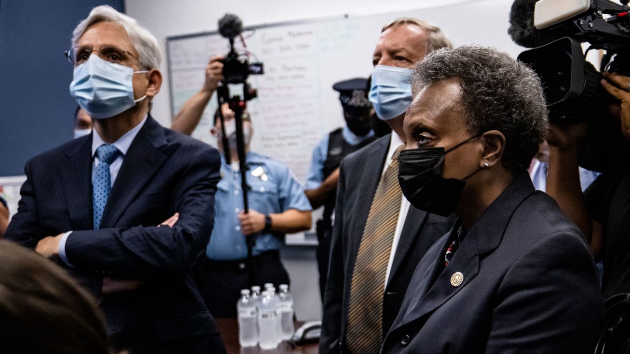 US Attorney General Merrick Garland (left), with Sen. Dick Durbin and Chicago Mayor Lori Lightfoot, visited Chicago in July. Chicago is among the five cities at the center of the Department of Justice's newest anti-gun trafficking strike forces.