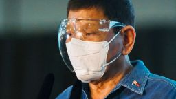 Philippine President Rodrigo Duterte wears a face shield and face mask while inside the Commission on Elections at the Sofitel Harbor Garden Tent in Metropolitan Manila, Philippines on Saturday, Oct. 2, 2021. Duterte says he is backing out of an announced plan to run for vice president in next year's elections and will retire from politics after his term ends. (Lisa Marie David/Pool Photo via AP)