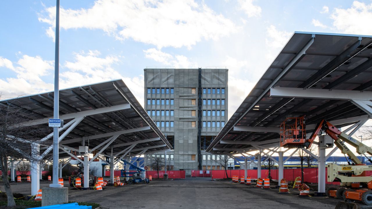 Solar panels powering the hotel cover its parking lot and roof.