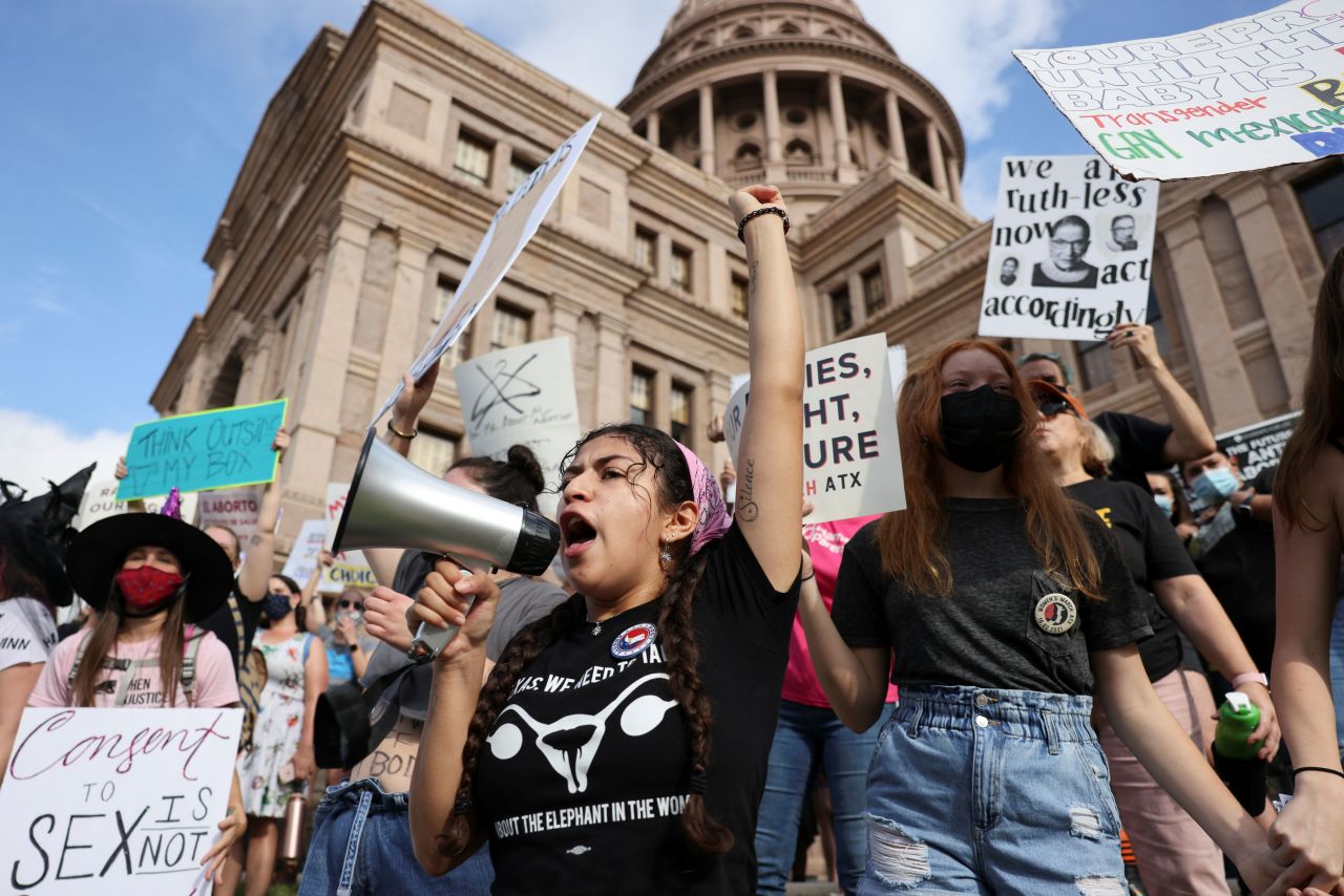Lexi, 22, speaks on a megaphone as women's rights advocates rally outside the Texas State Capitol in Austin, Texas.