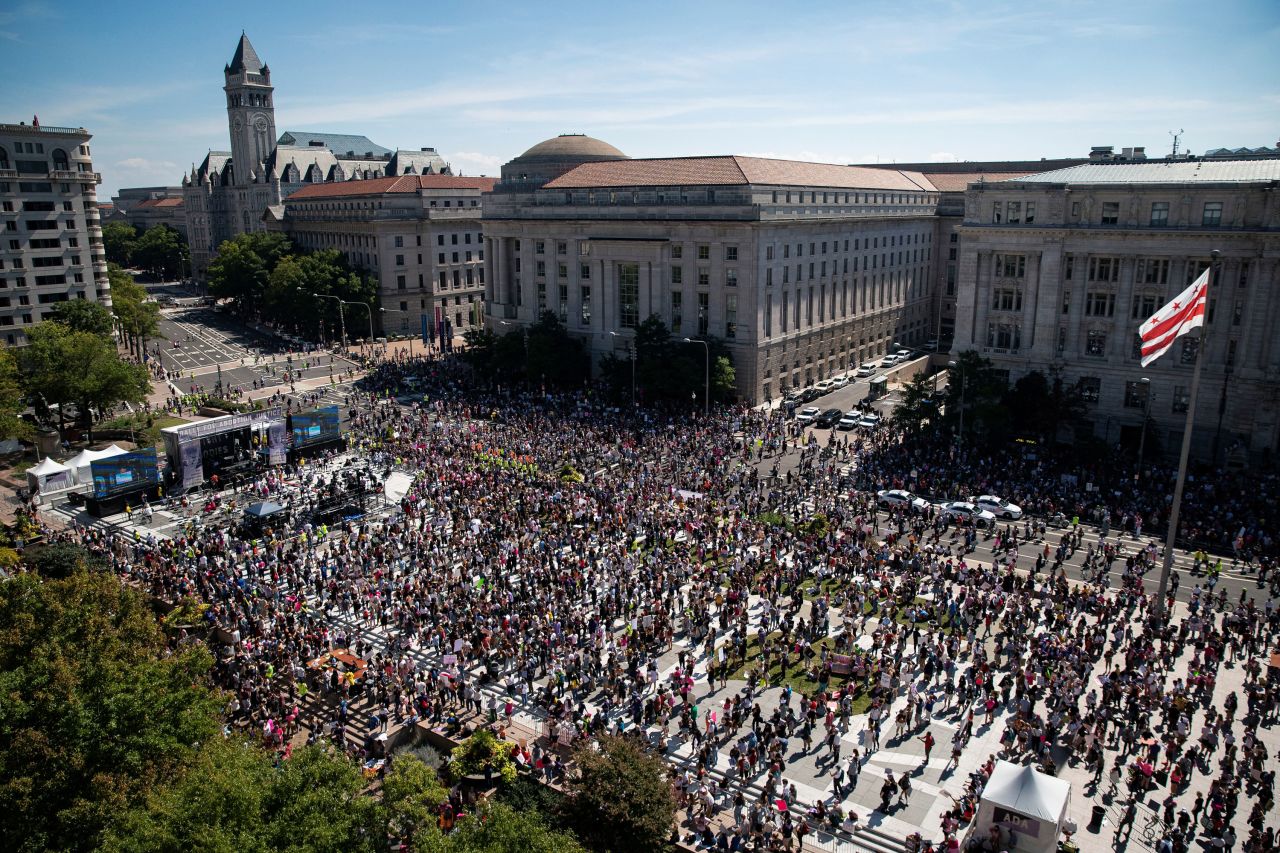 Supporters rally at Freedom Plaza before marching to the Supreme Court in Washington, DC.