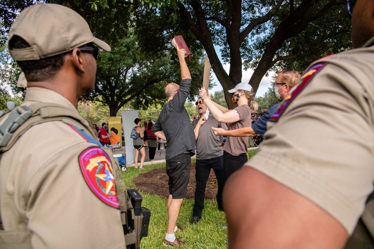 A protester and counter-protester have an altercation in Austin, Texas.