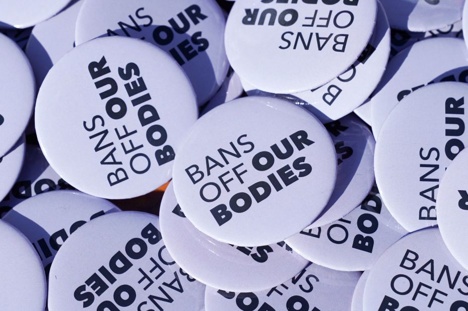 Buttons with the statement "Bans Off Our Bodies" are seen at a rally in Washington, DC.