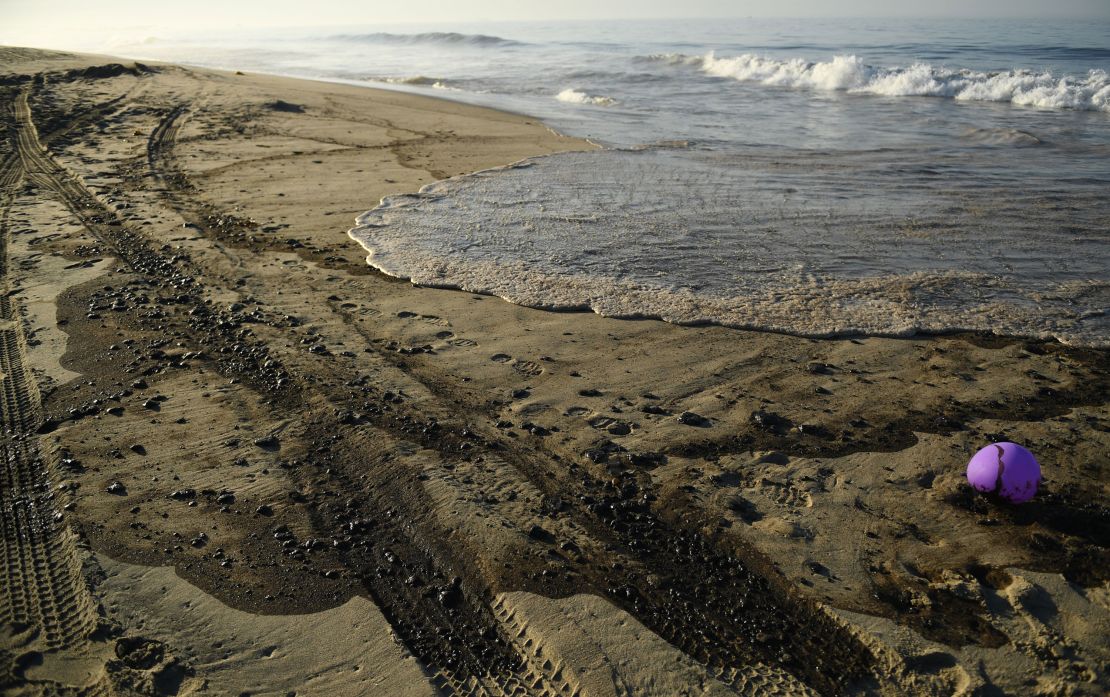 Oil settles on the beach Sunday in Huntington Beach, California.