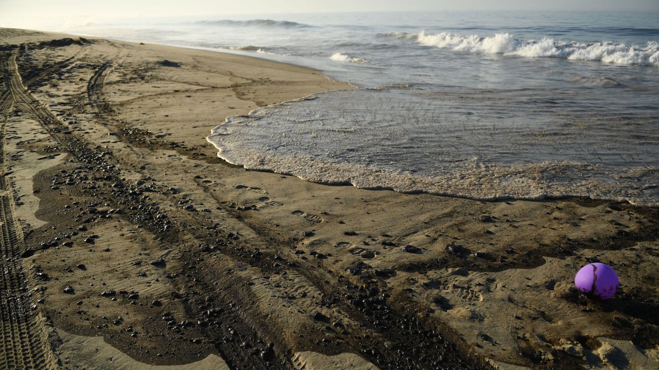 Oil settles on the beach Sunday in Huntington Beach, California.