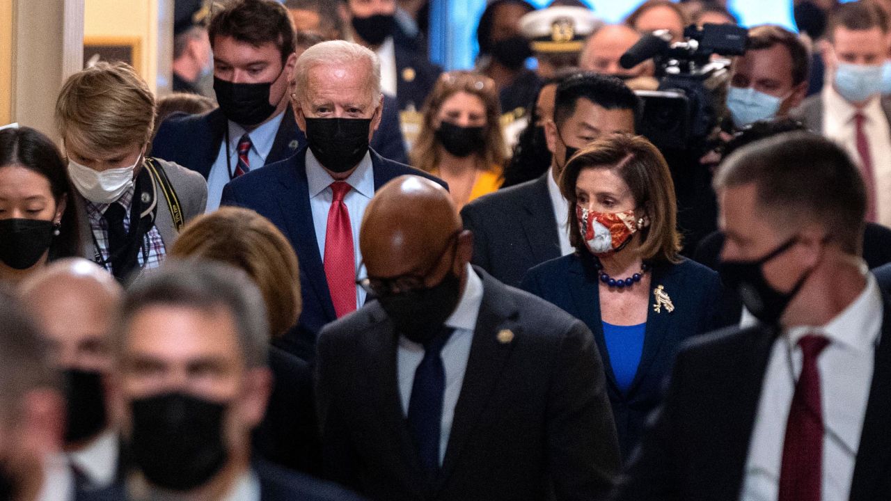 President Joe Biden flanked by Speaker of the House Nancy Pelosi are seen in October in Washington, DC.