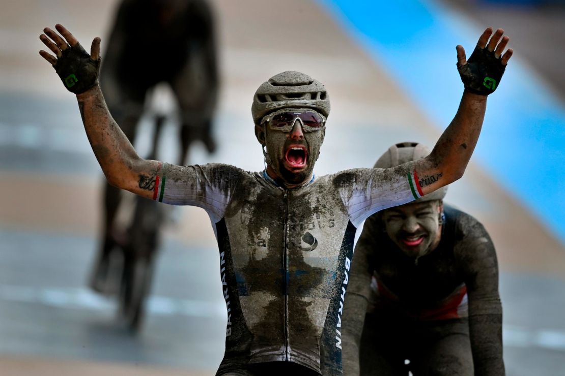 Colbrelli raises his arms in the air as he wins the Paris-Roubaix.