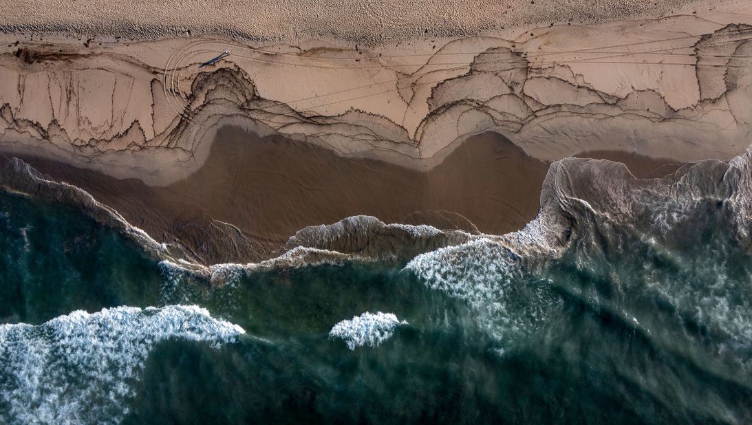 This aerial photo shows oil that had washed ashore in Huntington Beach.