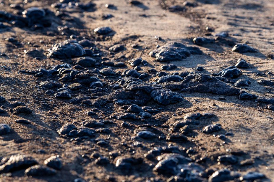 Globs of oil are seen on the border of Huntington Beach and Newport Beach on October 3.