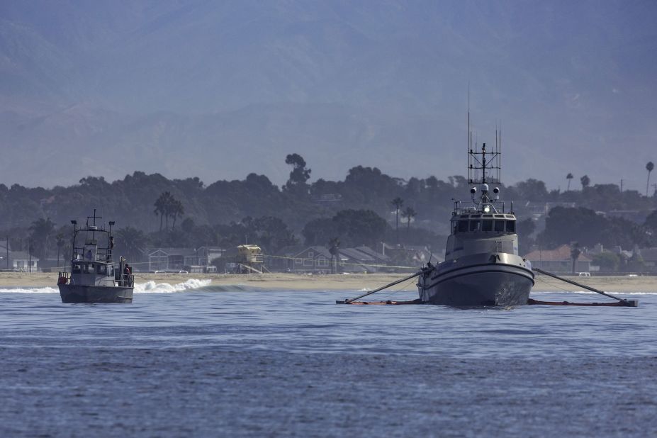 Oil-skimming boats work the waters off the coast of Huntington Beach on October 3.