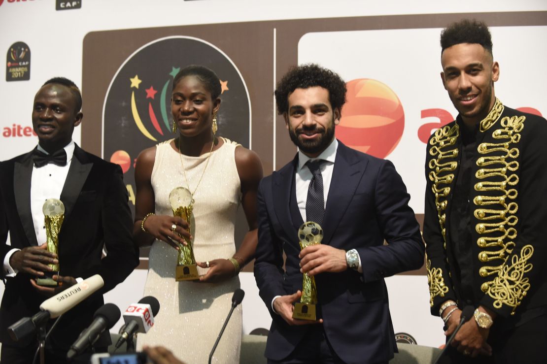 Footballing royalty: The Nigerian picked up her third African Female Footballer of the Year at the 2017 CAF Awards with Liverpool and Egypt's Mohamed Salah (R) picking up the Men's Award