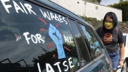 Mandatory Credit: Photo by Myung J Chun/Los Angeles Times/Shutterstock (12471917h)
Crystal Kan, a storyboard artist, draws pro-labor signs on cars of union members during a rally at the Motion Picture Editors Guild IATSE Local 700 on Sunday, Sept. 26, 2021 in Los Angeles, CA. Up to 60,000 members of the International Alliance of Theatrical Stage Employees (IATSE) might go on strike in the coming weeks over issues of long working hours, unsafe conditions, less pay from streaming companies and demand for better benefits. (Myung J. Chun / Los Angeles Times)
Los angeles iatse union film strike, Los Angeles, California, United States - 26 Sep 2021