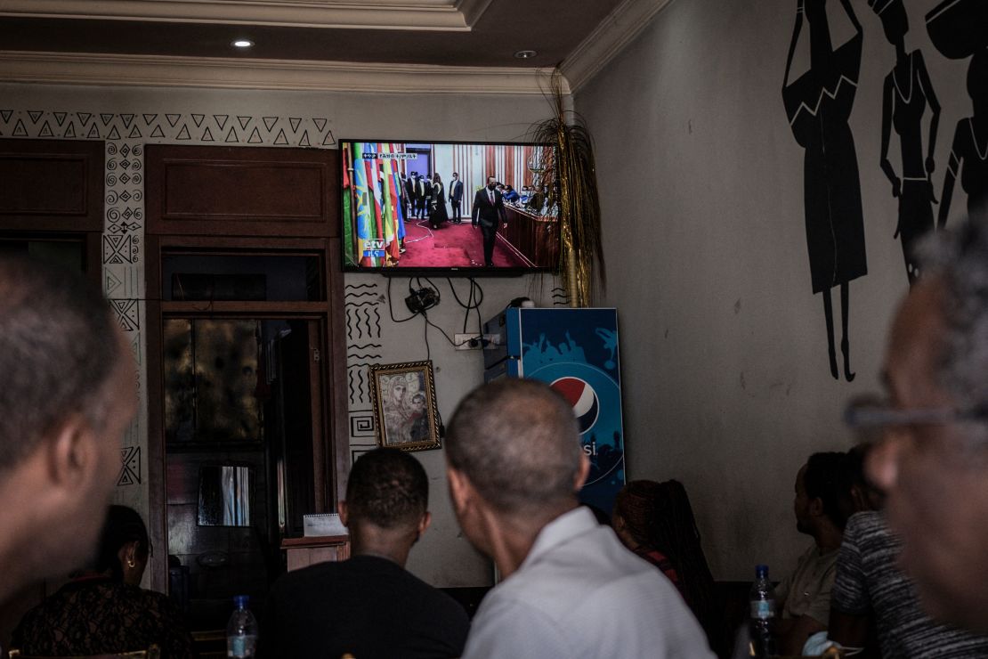 People watch Prime Minister Abiy Ahmed's swearing-in ceremony at an Addis Ababa coffee shop in October.
