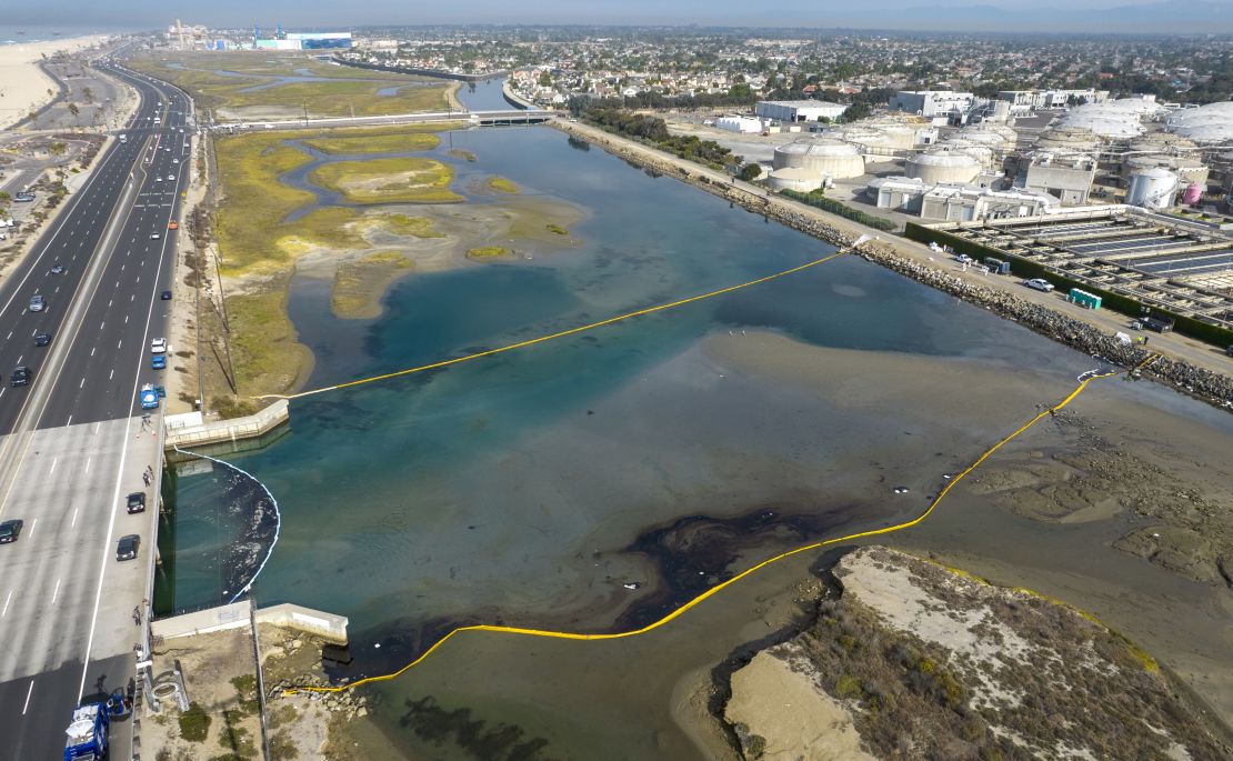 Booms float in the Talbert Marsh in Huntington Beach, California, as workers try to limit the spread of oil from an offshore spill.