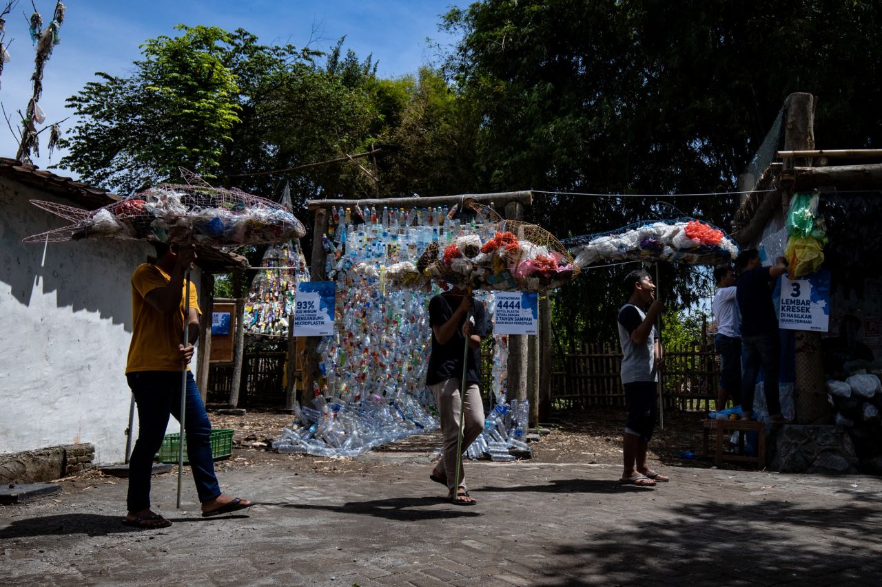 Activists help prepare a plastic waste museum in Java.