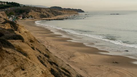 A darkened beach near Newport Beach, California, in the affected area of the oil spill.