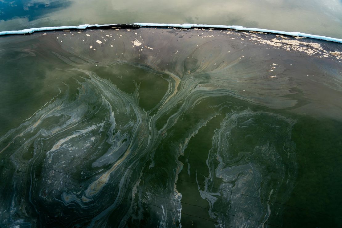 Boom traps oil under the Talbert Channel in the affected area of the oil spill off the coast of  in Huntington Beach, California on Monday, October 4, 2021.