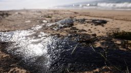 HUNTINGTON BEACH, CALIFORNIA - OCTOBER 03: Oil is washed up on Huntington State Beach after a 126,000-gallon oil spill from an offshore oil platform on October 3, 2021 in Huntington Beach, California. The spill forced the closure of the popular Great Pacific Airshow with authorities urging people to avoid beaches in the vicinity.  (Photo by Mario Tama/Getty Images)