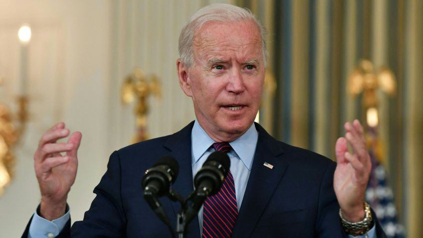 US President Joe Biden gestures as he delivers remarks on the debt ceiling from the State Dining Room of the White House on October 4, 2021 in Washington, DC. - President Joe Biden on Monday called Republican opponents "reckless and dangerous" for refusing to join Democrats in raising the US debt limit, putting the world's biggest country at risk of imminent default.