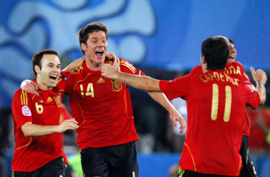 Andres Iniesta, Alonso and defender Joan Capdevila celebrate after winning Euro 2008.
