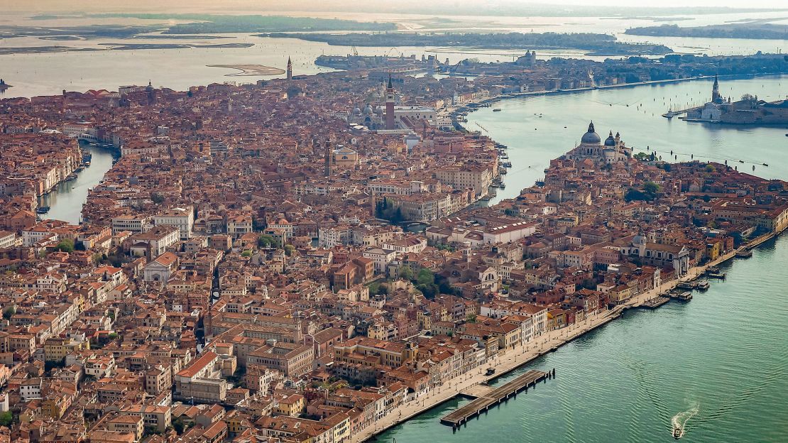 From the air, you can see Venice's network of canals glistening in the sunlight.
