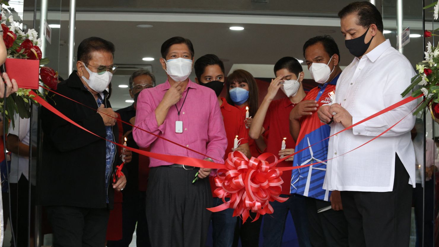 Former Philippine senator Ferdinand "Bongbong" Marcos (front 2nd left), leads the inauguration of his national headquarters in Mandaluyong City, Manila on October 5.