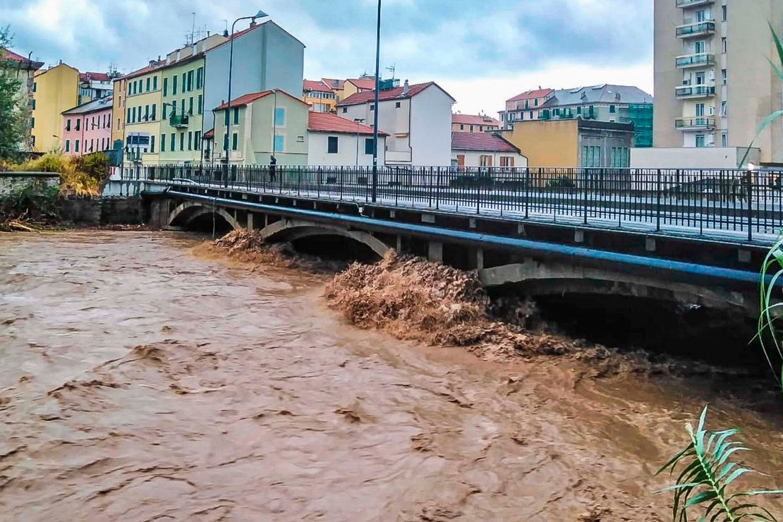 A view of a river near Savona in Northern Italy, swallowed after heavy rains in the region, on Oct. 4, 2021. Heavy rain battered the northwest region of Italy bordering France, causing flooding and mudslides on Monday in several places.