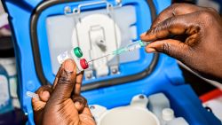 A health worker measures the dosage of malaria vaccine in Ndhiwa, Homabay County, western Kenya on September 13, 2019 during the launch of malaria vaccine in Kenya. - The vaccine (Mosquirix) is the world's first malaria vaccine that has been shown to provide partial protection against malaria in young children and has been rolled out by World Health Organisation in Kenya, Ghana and Malawi. (Photo by Brian ONGORO / AFP) (Photo by BRIAN ONGORO/AFP via Getty Images)