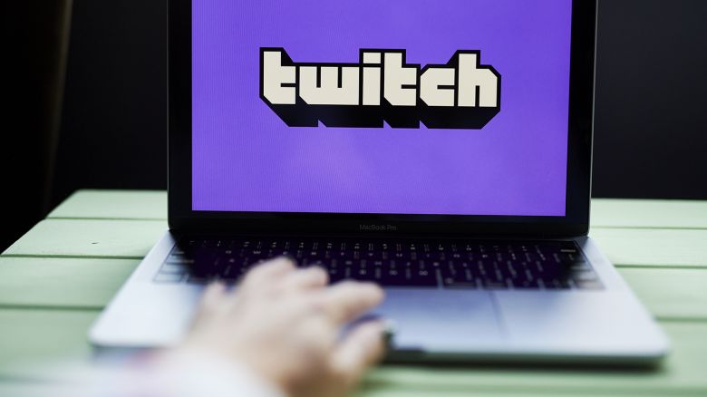 The logo for Twitch is displayed on a laptop computer in an arranged photograph taken in Little Falls, New Jersey, U.S., on Wednesday, Oct. 7, 2020. Twitch's market share of hours streamed jumped to 91% in the third quarter, up 15% from the second quarter, according to a report from streaming-software provider Streamlabs, which used data from Stream Hatchet.