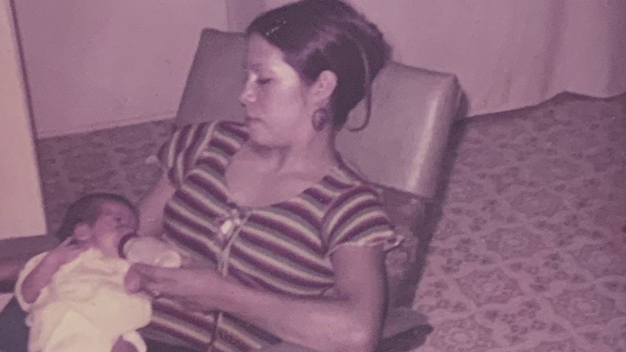 Rosie Jimenez feeds her daughter Monique, left, in an undated photo. 