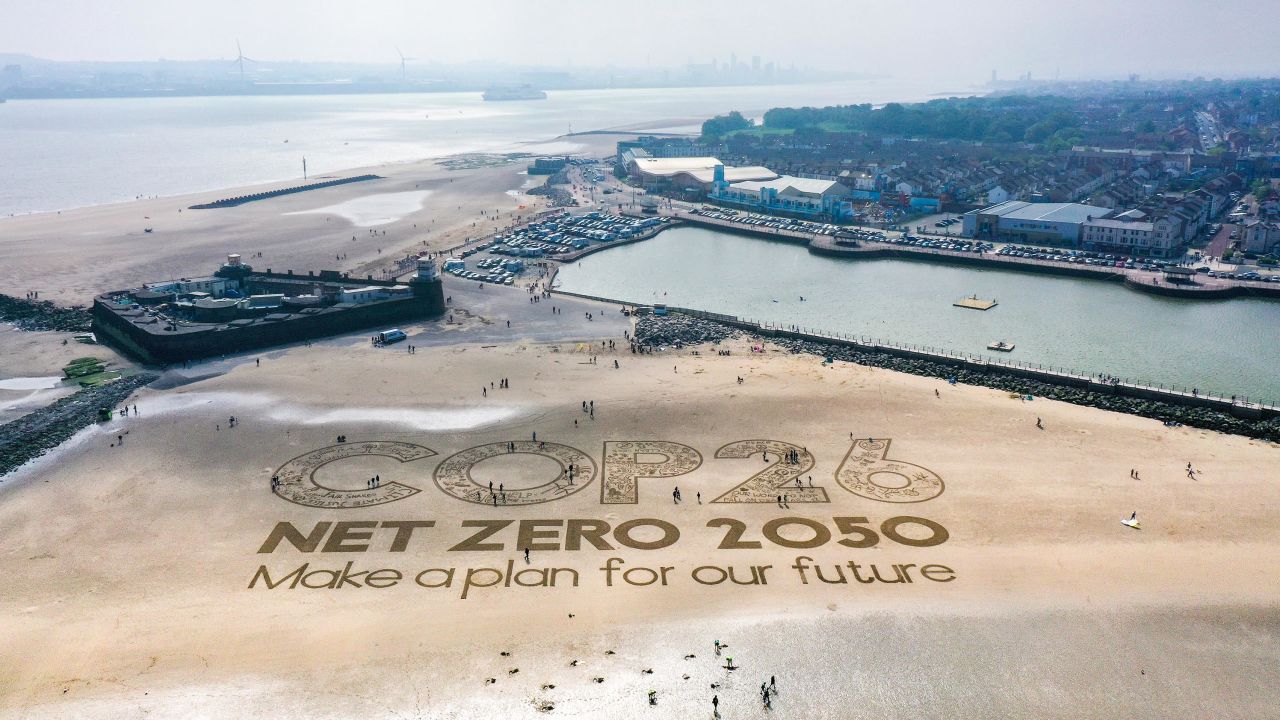 A giant sand artwork adorns New Brighton Beach on May 31, 2021 in Wirral, England, to highlight global warming and the COP26 climate conference.