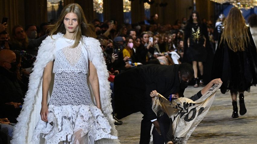 Louis Vuitton fashion show interrupted by climate activists | CNN