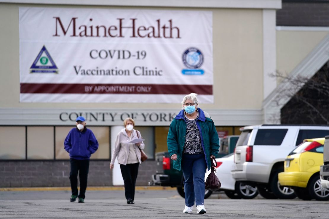 Senior citizens leave a vaccination site at a former department store in Sanford.