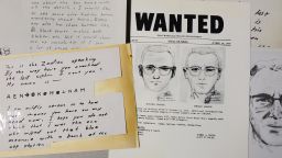 FILE - In this May 3, 2018, file photo, a San Francisco Police Department wanted bulletin and copies of letters sent to the San Francisco Chronicle by a man who called himself Zodiac are displayed in San Francisco. A coded letter mailed to a San Francisco newspaper by the Zodiac serial killer in 1969 has been deciphered by a team of amateur sleuths from the United States, Australia and Belgium, the San Francisco Chronicle reported Friday, Dec. 11, 2020. (AP Photo/Eric Risberg, File)
