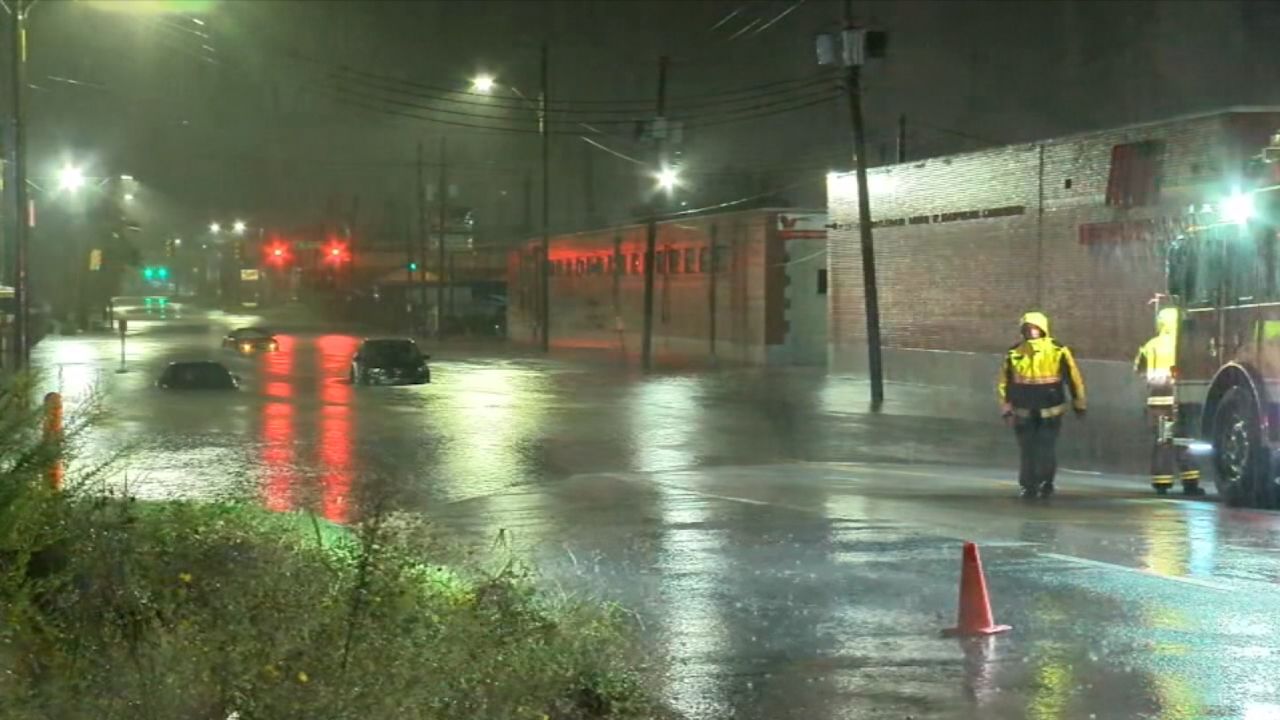 Vehicles are stranded in a flooded area of Birmingham, Alabama.