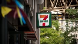 Signage is displayed outside a 7-Eleven store, a subsidiary of Seven & i Holdings Co., in Chicago, Illinois, U.S., on Monday, Aug. 3, 2020. Seven & i Holdings Co., the world's largest convenience-store franchiser, agreed to buy Marathon Petroleum Corp.s Speedway gas stations for $21 billion, betting that an expanded U.S. footprint will deliver growth amid the uncertainty of the pandemic. Photographer: Christopher Dilts/Bloomberg via Getty Images