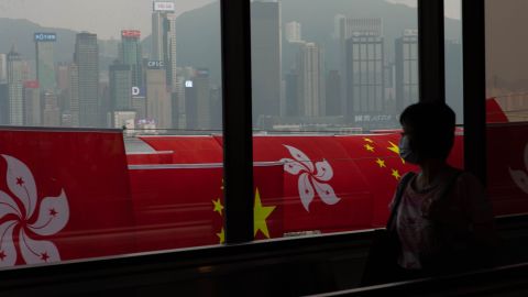 A woman looks out at Hong Kong's Victoria Harbor on September 30. 