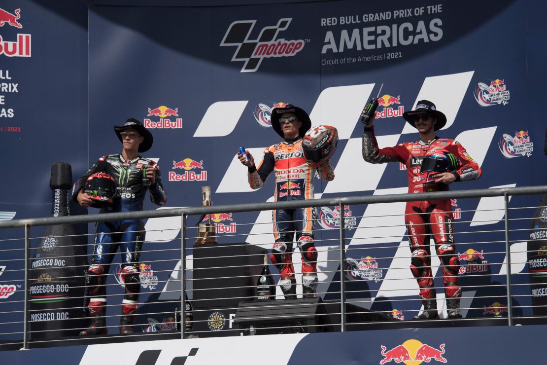 Fabio Quartararo, Marc Marquez and Bagnaia celebrate on the podium  after the MotoGP Grand Prix of the Americas race on October 03, 2021 in Austin, Texas.