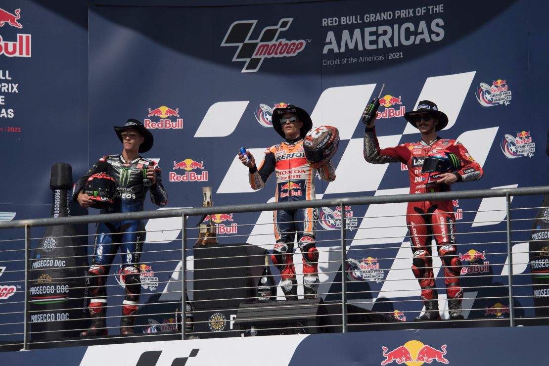Fabio Quartararo, Marc Marquez and Bagnaia celebrate on the podium after the MotoGP Grand Prix of the Americas race on October 03, 2021 in Austin, Texas.