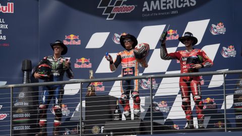 Fabio Quartararo, Marc Marquez and Bagnaia celebrate on the podium  after the MotoGP Grand Prix of the Americas race on October 03, 2021 in Austin, Texas.