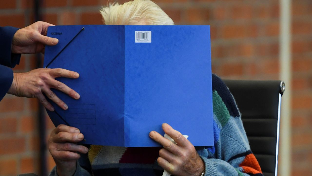 A 100-year-old former security guard of the Sachsenhausen concentration camp appears in the courtroom before his trial.